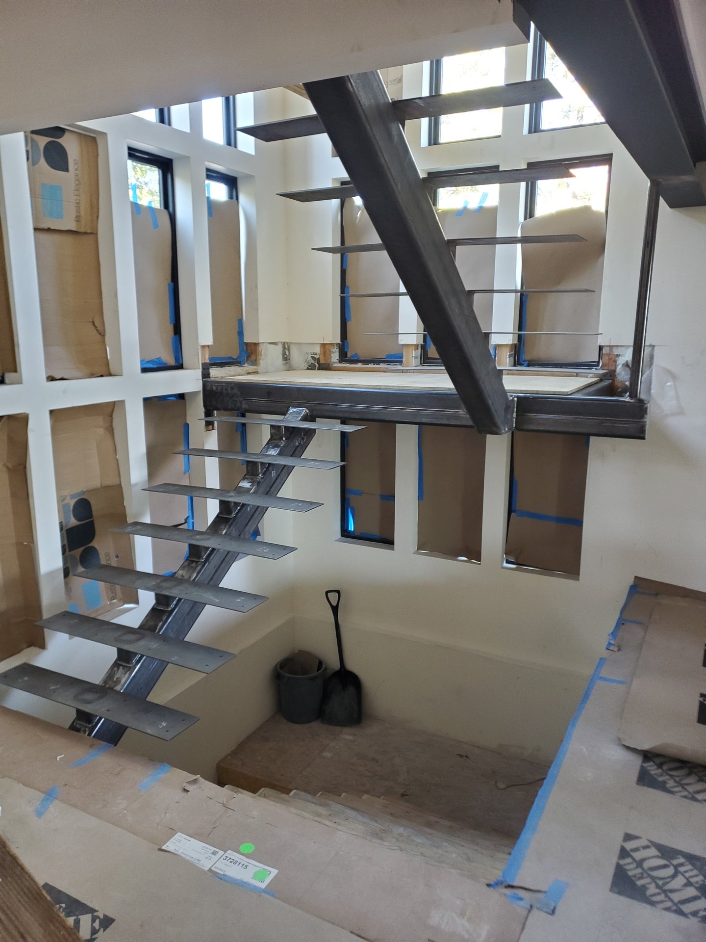 Cantilevered steel stair treads on a floating mono-stringer staircase